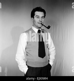 Man smoking pipe. c1964. Stock Photo