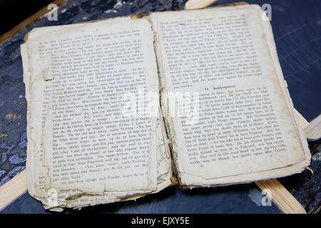 Old and worn textbook Stock Photo