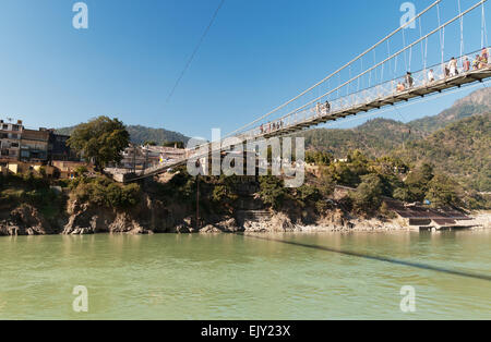 Laxman Jhula bridge over Ganges river. Rishikesh Stock Photo