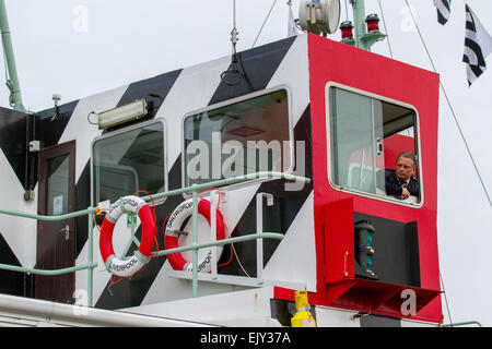 Throw Over Lifebuoy outside the Bridge of Snowdrop, Liverpool, Merseyside, UK 2nd April, 2015.  Captain on the bridge on the Inaugural sailing of Newly Painted Dazzle Ferry across the Mersey.  Boats close ups;  the Snowdrop has been re-painted in a unique design created by Sir Peter Blake, the artist behind the cover of the Beatles' Sgt Pepper album.  This form of camouflage was invented in World War One to confuse the enemy, as the bright and twisty designs made it hard for hostile forces to track the range and speed of allied ships. The Snowdrop was repainted at Cammell Laird in Birkenhead. Stock Photo