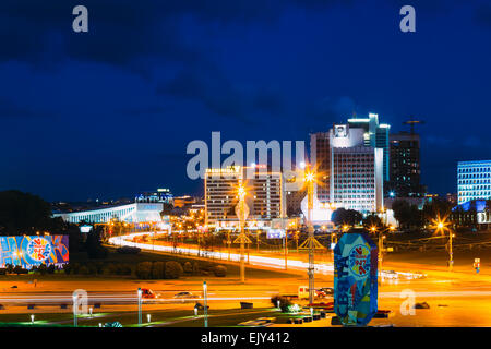 Night Panoramic Scene Street Pobediteley Avenue, Building Downtown in Belarussian capital Stock Photo