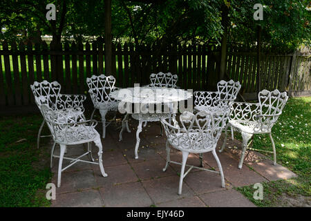 white wrought iron metal table chairs patio furniture shade shaded sheltered garden gardening RM Floral Stock Photo