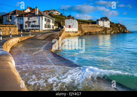 The slipway at Portmellon near Mevagissey in Cornwall, with The Rising Sun Inn in the distance. Stock Photo