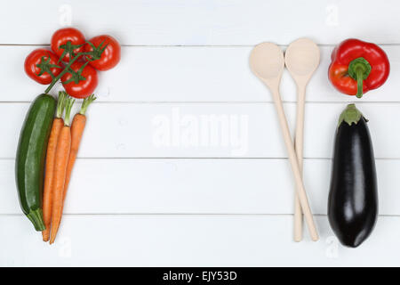 Healthy cooking with vegetarian vegetables ingredients and copyspace on a wooden table Stock Photo