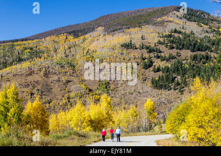 Trio hike on the old Vail pass in autumn Stock Photo