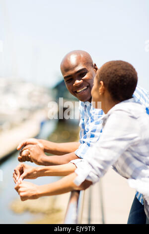 cute African couple relaxing at the harbor Stock Photo