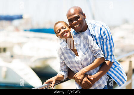 portrait of cheerful African couple at the harbor Stock Photo