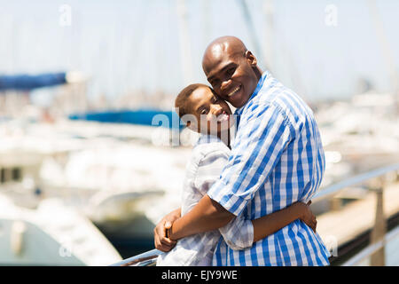 cute young black couple hugging at the harbor Stock Photo