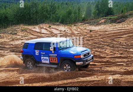 Races on a rally-raid on sandy dunes. Rally-raid Baha 'Belarus' 2014 - second day. Stock Photo