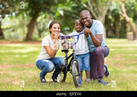 portrait of cute young African family of three outdoors Stock Photo