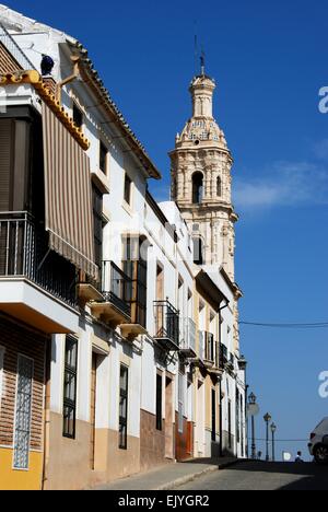 Baroque clock tower (Torre del Reloj) along Calle Desamparados, Aguilar de la Frontera, Cordoba Province, Andalusia, Spain. Stock Photo