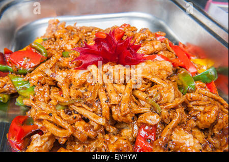 Closeup of seafood in ginger pepper sauce chinese meal on display at a hotel buffet Stock Photo