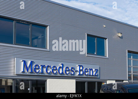 exterior of a mercedes-benz truck dealer. Mercedes-Benz Trucks is now part of the Daimler Trucks division, and includes companie Stock Photo