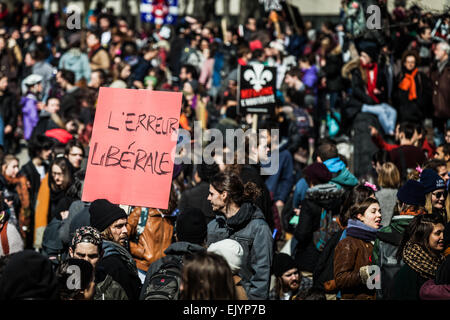 MONTREAL, CANADA, APRIL 02 2015. Riot in the Montreal Streets to counter the Economic Austerity Measures. Crowd with Placard, Fl Stock Photo