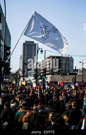 MONTREAL, CANADA, APRIL 02 2015. Riot in the Montreal Streets to counter the Economic Austerity Measures. Crowd with Placard, Fl Stock Photo
