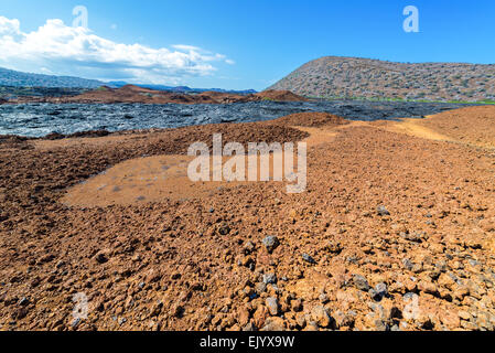 Barren landscape with dry lava flow visible on Santiago Island in the Galapagos Islands in Ecuador Stock Photo