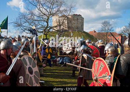 Vikings and Anglo Saxons in combat at Cliffords Tower during the Annual Viking Festival York North Yorkshire England UK United Kingdom Great Britain Stock Photo