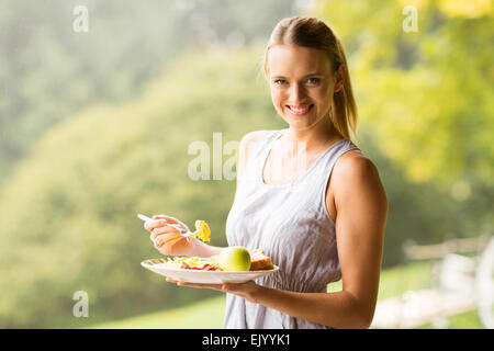 portrait of pretty woman eating breakfast Stock Photo