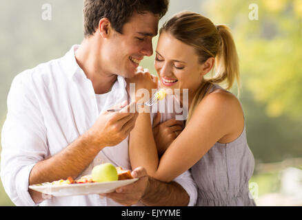 beautiful young couple eating breakfast together Stock Photo