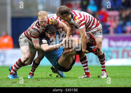 Wigan, UK. 03rd Apr, 2015. Super League Rugby. Wigan Warriors versus St Helens. Alex Walmsley of St Helens is tackled in the air by Liam Farrell of Wigan Warriors and Logan Tomkins of Wigan Warriors Credit:  Action Plus Sports/Alamy Live News Stock Photo