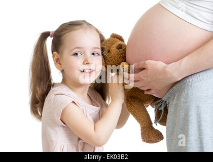 happy kid girl playing with pregnant mother Stock Photo