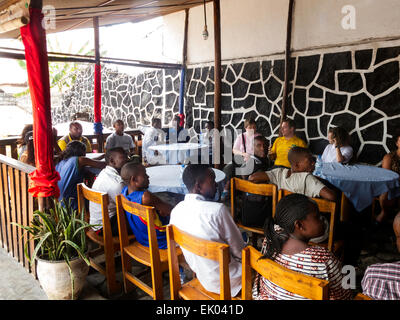 Congolese people sitting in a restaurant, Goma, North Kivu province, Democratic Republic of Congo, ( DRC ), Africa Stock Photo