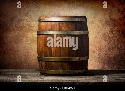 Wooden barrel on a table and textured background Stock Photo