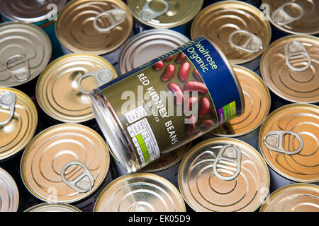 A can of red kidney beans in a drawer of canned food. Stock Photo