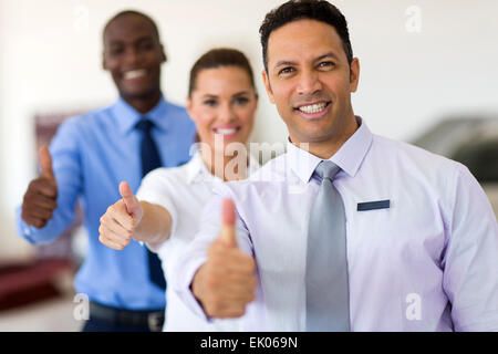 cheerful business group giving thumbs up Stock Photo