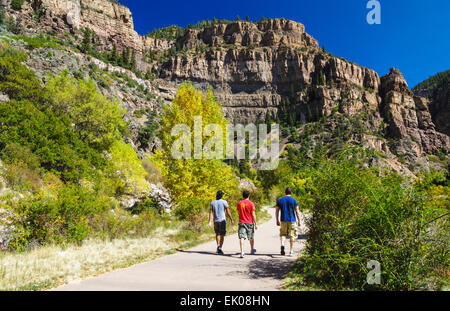 Hikers in Glenwood Canyon venture toward Hanging Lake trail Stock Photo