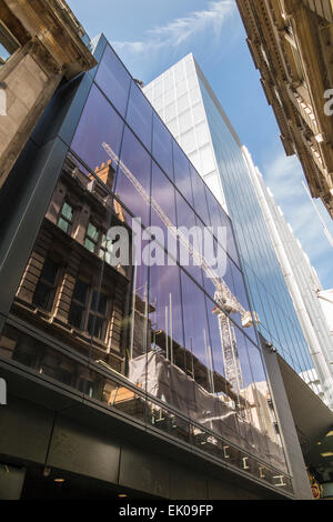 New Court, St Swithin's Lane, London EC4, headquarters of Rothschild bank in the City of London, with reflection of tower crane Stock Photo