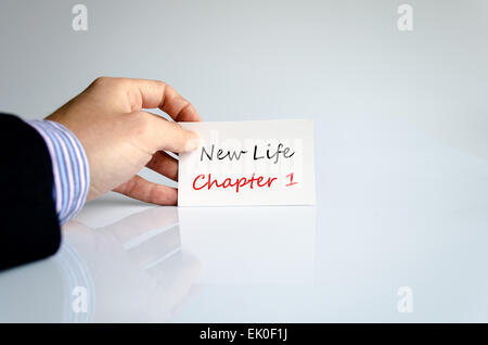 Business man hand holding business concept message New life chapter 1 Stock Photo