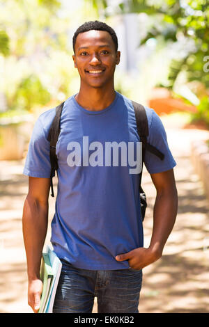 African american male student with a backpack sitting on a chair ...