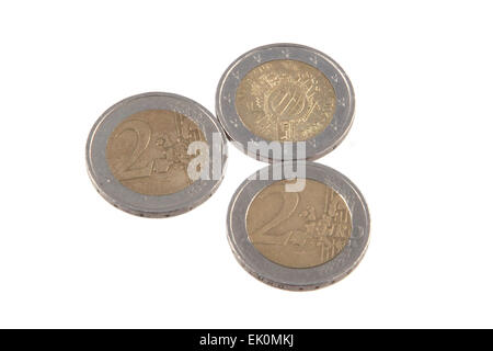Close up photo Euro coins on a plain white background. Stock Photo