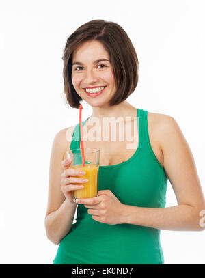 Portrait of a young woman drinking an orange juice with a straw, isolated on white Stock Photo
