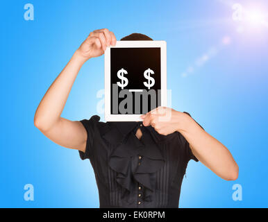 Girl in dress covered her face with tablet. On screen code smiley Stock Photo