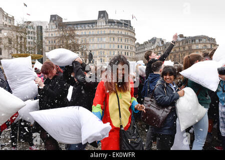 London, UK. 4th April, 2015. In Trafalgar Square thousands of pillow fighters battered each other until the feathers flew for International Pillow Fight Day. The display of pillow pulverising was spectacular with everyone eager to display their fighting prowess with feather and sponge filled pillows.  Alamy Live News/Photographer Credit:  Gordon Scammell Stock Photo
