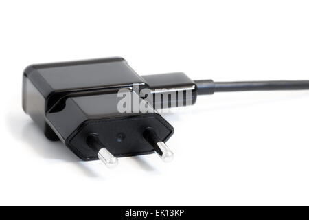 Closeup of an AC power adapter plug isolated on white background Stock Photo