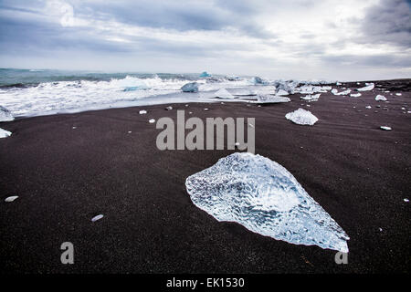 View of piece of ice from an iceberg by the ocean near the Jokulsarlon glacial lagoon in south Iceland Stock Photo