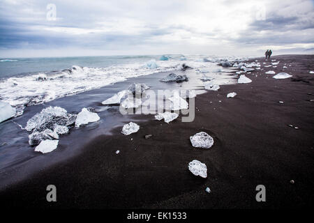 View of pieces of ice from icebergs by the ocean near the Jokulsarlon glacial lagoon in south Iceland Stock Photo