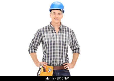 Confident construction guy in uniform wearing blue helmet and posing isolated on white background Stock Photo