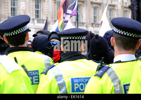 London, UK. 4th April, 2015. Protesters against Pegida threw fireworks and engaged in scuffles with Police Credit:  Rachel Megawhat/Alamy Live News Stock Photo