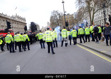 London, UK. 4th April, 2015. Protesters against Pegida threw fireworks and engaged in scuffles with Police Credit:  Rachel Megawhat/Alamy Live News Stock Photo