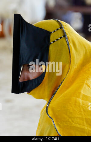 Bedu (Bedouin) woman at animal market in Sinaw, Oman Stock Photo