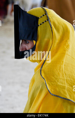 Bedu (Bedouin) woman at animal market in Sinaw, Oman Stock Photo