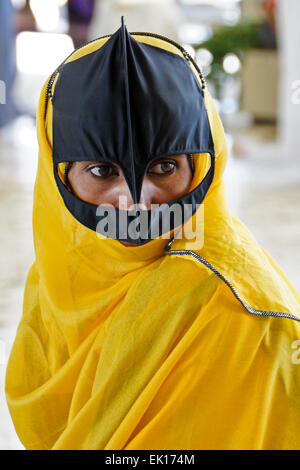 Bedu (Bedouin) woman at animal market in Sinaw, Oman Stock Photo