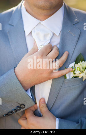 hands of groom in blue suit. unrecognizable man. groom getting ready for the wedding Stock Photo