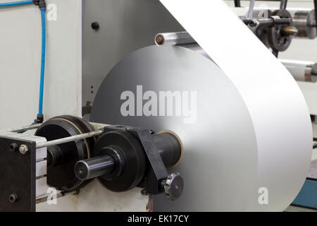 roll paper on printing machine close up Stock Photo