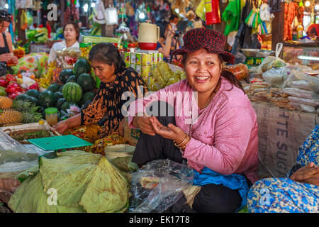 Smiling woman sells vegetables at the market (Siem Reap) Stock Photo