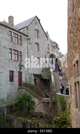 Mont Saint Michel, Normandy , France - January 2, 2014: View Houses inside wall center of Mont Saint Michel monastery on the nor Mont Saint Michel, Normandy , France - January 2, 2014: View Houses inside wall center of Mont Saint Michel monastery on the nor